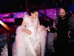Radhika Merchant wears a blush pink gown with Anant Ambani during their pre-wedding celebrations. Radhika Merchant wears a blush pink gown with Anant Ambani during their pre-wedding celebrations.