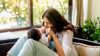 Kajal Aggarwal often posts pictures with son Neil on her Instagram. In this picture, she is seen playing with Neil and kissing his fingers. Kajal Aggarwal often posts pictures with son Neil on her Instagram. In this picture, she is seen playing with Neil and kissing his fingers.