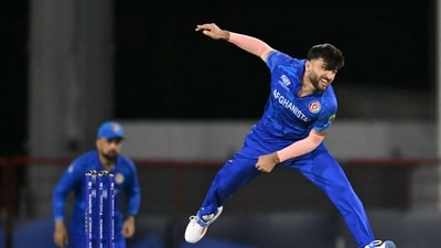 Afghanistan's Fazalhaq Farooqi bowls during the ICC men's Twenty20 World Cup 2024 group C cricket match between the West Indies and Afghanistan at Daren Sammy Cricket Ground (AFP)