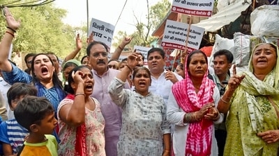Bharatiya Janata Party (BJP) chief Virendra Sachdeva, party MP Bansuri Swaraj and others raise slogans as they stage a protest against the Aam Aadmi Party (AAP)-led Delhi government over the ongoing water shortage the national capital on June 19. (ANI) Bharatiya Janata Party (BJP) chief Virendra Sachdeva, party MP Bansuri Swaraj and others raise slogans as they stage a protest against the Aam Aadmi Party (AAP)-led Delhi government over the ongoing water shortage the national capital on June 19. (ANI)