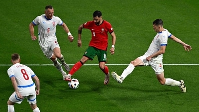 Portugal's midfielder #08 Bruno Fernandes (C) controls the ball between Czech Republic's defender #05 Vladimir Coufal (L) and Czech Republic's defender #04 Robin Hranac (R) (AFP) Portugal's midfielder #08 Bruno Fernandes (C) controls the ball between Czech Republic's defender #05 Vladimir Coufal (L) and Czech Republic's defender #04 Robin Hranac (R) (AFP)