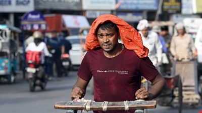 New Delhi, India - June 19, 2024: A rickshaw puller seen during Hot weather at Kamla Market, in New Delhi, India, on Wednesday, June 19, 2024. (Photo by Sanjeev Verma/ Hindustan Times) (Hindustan Times) New Delhi, India - June 19, 2024: A rickshaw puller seen during Hot weather at Kamla Market, in New Delhi, India, on Wednesday, June 19, 2024. (Photo by Sanjeev Verma/ Hindustan Times) (Hindustan Times)