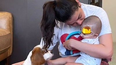 It was family time for Kajal Aggarwal, as she shared this adorable picture with her son Neil, and her pet dog Mia. Did you know, Kajal's husband had to convince her to welcome a dog into their lives? This is because Kajal has a phobia of dogs since childhood. It was family time for Kajal Aggarwal, as she shared this adorable picture with her son Neil, and her pet dog Mia. Did you know, Kajal's husband had to convince her to welcome a dog into their lives? This is because Kajal has a phobia of dogs since childhood.