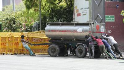NDMC workers move a water tanker amid a searing heatwave and water crisis in New Delhi. (PTI Photo) NDMC workers move a water tanker amid a searing heatwave and water crisis in New Delhi. (PTI Photo)