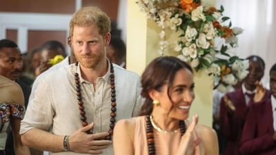 Prince Harry ‘homesick’ but Meghan Marke feels ‘rejected by the UK' (Photo by Kola SULAIMON / AFP) (AFP) Prince Harry ‘homesick’ but Meghan Marke feels ‘rejected by the UK' (Photo by Kola SULAIMON / AFP) (AFP)