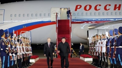 Russian President Vladimir Putin is welcomed by North Korean leader Kim Jong Un upon his arrival at an airport in Pyongyang, North Korea, in this image released by the Korean Central News Agency June 19, 2024. (KCNA via REUTERS)