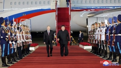 Russian President Vladimir Putin is welcomed by North Korean leader Kim Jong Un upon his arrival at an airport in Pyongyang, North Korea, in this image released by the Korean Central News Agency June 19, 2024. (Reuters)