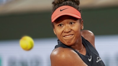 Paris, France; Naomi Osaka of Japan keeps her eye on the ball during her match against Iga Świątek of Poland at Stade Roland Garros (USA TODAY Sports via Reuters Con)