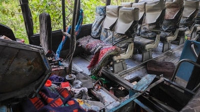 Reasi: The damaged bus, which was carrying pilgrims. (PTI) Reasi: The damaged bus, which was carrying pilgrims. (PTI)