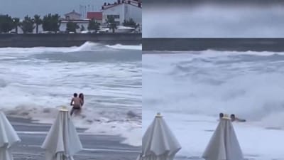 Russia: Man trying to save his girlfriend before she was washed away by massive waves in Sochi.