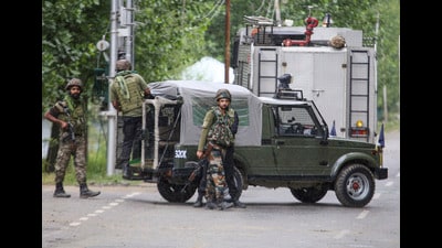 Security forces personnel during an encounter with militants, in Sopore, Baramulla, on Wednesday. (PTI)