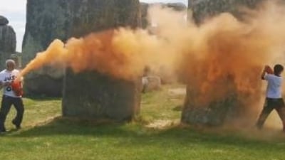 After environmental activists sprayed an orange substance on Stonehenge, a UNESCO world heritage site in southwest England, police arrested two people on Wednesday. After environmental activists sprayed an orange substance on Stonehenge, a UNESCO world heritage site in southwest England, police arrested two people on Wednesday.