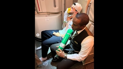 Jack Fowler and an Emirates staff with oxygen tank. (Instagram) Jack Fowler and an Emirates staff with oxygen tank. (Instagram)