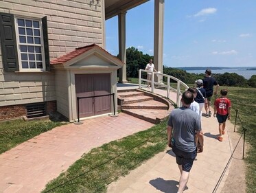 Tourists walk by a cellar door at George Washington's residence in Mount Vernon. (AP) Tourists walk by a cellar door at George Washington's residence in Mount Vernon. (AP)