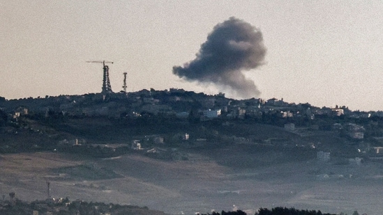 A smoke plume billows during Israeli bombardment (AFP)