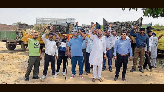 Waste collectors protesting near the PUDA building in Mohali on Wednesday. (HT Photo)