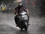 Commuters travel during light rain in Noida, (Sunil Ghosh /HT file) Commuters travel during light rain in Noida, (Sunil Ghosh /HT file)