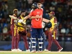 England's Phil Salt embraces teammate Jonathan Bairstow, right, after defeating the West Indies in their men's T20 World Cup.