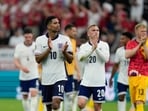 England's Jude Bellingham, left, Jarrod Bowen, center, and goalkeeper Aaron Ramsdale greet supporters at the end of a Group C match between Denmark and England at the Euro 2024 soccer tournament in Frankfurt England's Jude Bellingham, left, Jarrod Bowen, center, and goalkeeper Aaron Ramsdale greet supporters at the end of a Group C match between Denmark and England at the Euro 2024 soccer tournament in Frankfurt