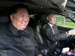 North Korea's leader Kim Jong Un (L) sitting in the passenger seat of a car driven by Russia's President Vladimir Putin (R) in the garden of the Kumsusan State Guesthouse in Pyongyang. 