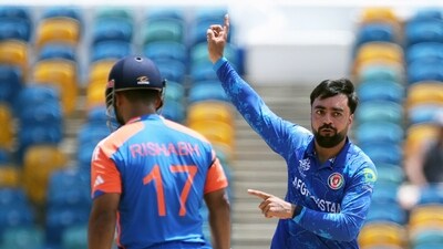  Rashid Khan dismissed Rishabh Pant and Virat Kohli after the powerplay as Afghanistan kept India in check in the first 10 overs. (ACBofficials - X) Rashid Khan dismissed Rishabh Pant and Virat Kohli after the powerplay as Afghanistan kept India in check in the first 10 overs. (ACBofficials - X)