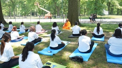 Women are seen in ‘Padmasan’ at Central Park of New York. (X/Indian in New York) Women are seen in ‘Padmasan’ at Central Park of New York. (X/Indian in New York)