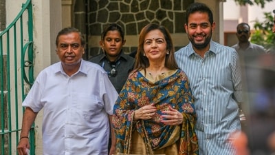 Reliance Industries chairman Mukesh Ambani with wife Nita Ambani and son Akash Ambani. (Bloomberg) Reliance Industries chairman Mukesh Ambani with wife Nita Ambani and son Akash Ambani. (Bloomberg)