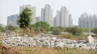 Illegally dumped C&D waste on a vacant plot along the Dwarka Expressway. (Parveen Kumar/HT Photo) Illegally dumped C&D waste on a vacant plot along the Dwarka Expressway. (Parveen Kumar/HT Photo)