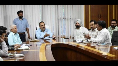 MC officials during a meeting with health branch employees in Ludhiana on Thursday. (HT photo)