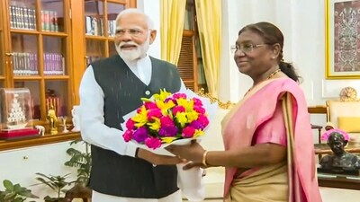 Modi praised President Murmu by saying that her emphasis on serving the poor and marginalised is her strong guiding force. (PTI) Modi praised President Murmu by saying that her emphasis on serving the poor and marginalised is her strong guiding force. (PTI)