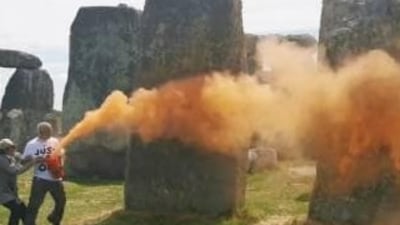 After environmental activists sprayed an orange substance on Stonehenge, a UNESCO world heritage site in southwest England, police arrested two people on Wednesday. After environmental activists sprayed an orange substance on Stonehenge, a UNESCO world heritage site in southwest England, police arrested two people on Wednesday.