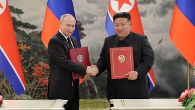 North Korea's leader Kim Jong Un (R) and Russia's President Vladimir Putin (L) shaking hands after a signing ceremony (AFP)