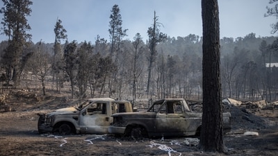 Vehicles sit outside a destroyed residence in the aftermath of the South Fork fire in Alto, New Mexico, U.S., June 19, 2024.  REUTERS/Adrees Latif (REUTERS)
