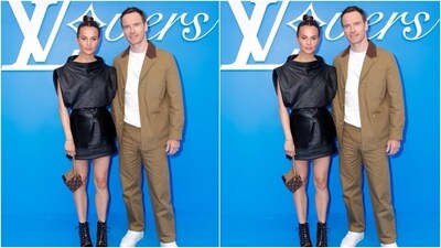 Alicia Vikander and Michael Fassbender attended Louis Vuitton's Menswear show in Paris – the couple posed for the cameras together. Alicia picked a black sleeveless top with bodice details, teamed with a black leather short skirt. Michael complemented her in a white T-shirt, a dusty brown brazer and matching formal trousers. (Getty Images) Alicia Vikander and Michael Fassbender attended Louis Vuitton's Menswear show in Paris – the couple posed for the cameras together. Alicia picked a black sleeveless top with bodice details, teamed with a black leather short skirt. Michael complemented her in a white T-shirt, a dusty brown brazer and matching formal trousers. (Getty Images)