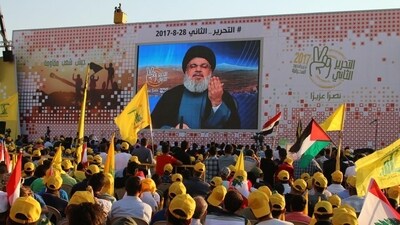 Hezbollah chief Hasan Nasrallah delivers a televised speech to his supporters at a rally in Baalbek. (File image) (AFP)