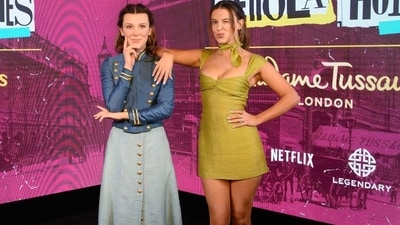 Millie Bobby Brown was seen in a light-green mini dress as she posed next to her wax statue at the iconic London museum. Since the story of Enola Holmes is set in the backdrop of 19th century London, the statue was dressed in a traditional dark blue full-sleeves shirt paired with a long grey skirt. The attire had golden buttons which added to the classy style quotient. Millie Bobby Brown was seen in a light-green mini dress as she posed next to her wax statue at the iconic London museum. Since the story of Enola Holmes is set in the backdrop of 19th century London, the statue was dressed in a traditional dark blue full-sleeves shirt paired with a long grey skirt. The attire had golden buttons which added to the classy style quotient.