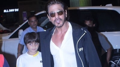 Shah Rukh Khan with AbRam at the Mumbai airport. Shah Rukh Khan with AbRam at the Mumbai airport.