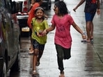 Children play in the rain in Mumbai. (ANI Photo)
