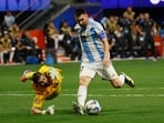 Argentina's Lionel Messi (10) lines up a shot, as he gets past Canada's goalkeeper Maxime Crépeau (16) during the second half of a Copa América match Argentina's Lionel Messi (10) lines up a shot, as he gets past Canada's goalkeeper Maxime Crépeau (16) during the second half of a Copa América match