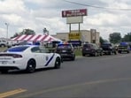 Police respond to the scene of a shooting on Friday, June 21, 2024 in Fordyce, Ark. Arkansas State Police say at least two people were killed and eight wounded in a shooting that occurred at a grocery store in south Arkansas. (KATV via AP) Police respond to the scene of a shooting on Friday, June 21, 2024 in Fordyce, Ark. Arkansas State Police say at least two people were killed and eight wounded in a shooting that occurred at a grocery store in south Arkansas. (KATV via AP)