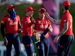 England celebrate a wicket. England celebrate a wicket.