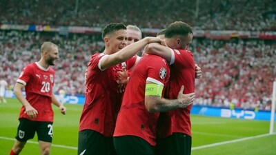 Austria's Marko Arnautovic , center, is embraced by teammates after scoring a goal during a Group D match against Poland. (AP) Austria's Marko Arnautovic , center, is embraced by teammates after scoring a goal during a Group D match against Poland. (AP)