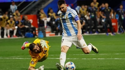 Argentina's Lionel Messi (10) lines up a shot, as he gets past Canada's goalkeeper Maxime Crépeau (16) during the second half of a Copa América match (AP) Argentina's Lionel Messi (10) lines up a shot, as he gets past Canada's goalkeeper Maxime Crépeau (16) during the second half of a Copa América match (AP)