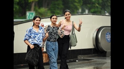 New Delhi, India - June 21, 2024: Young women react as they are clicked during rains, in New Delhi, Friday, June 21, 2024. Light rainfall on Friday brought some relief to the people in Delhi after a relentless heatwave in the region for over a month. (Photo by Sanjeev Verma/ Hindustan Times) (Hindustan Times) New Delhi, India - June 21, 2024: Young women react as they are clicked during rains, in New Delhi, Friday, June 21, 2024. Light rainfall on Friday brought some relief to the people in Delhi after a relentless heatwave in the region for over a month. (Photo by Sanjeev Verma/ Hindustan Times) (Hindustan Times)