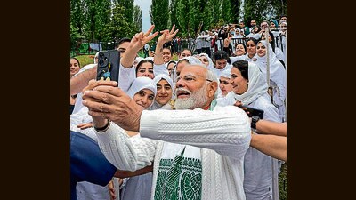 PM Modi taking selfie after the yoga session, at Dal Lake in Srinagar on Friday. (ANI) PM Modi taking selfie after the yoga session, at Dal Lake in Srinagar on Friday. (ANI)