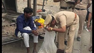 Police officials searching random individuals on Friday. (HT Photo) Police officials searching random individuals on Friday. (HT Photo)