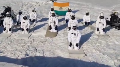 Despite the snowy weather, more than 10 soldiers were seen performing various asanas in the norther frontier on Friday. (ANI) Despite the snowy weather, more than 10 soldiers were seen performing various asanas in the norther frontier on Friday. (ANI)