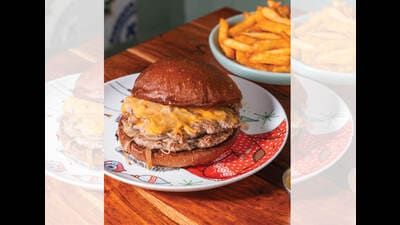 Smash burger patties at Veronica’s in Mumbai have a greater surface area, delivering a more complex crust. Smash burger patties at Veronica’s in Mumbai have a greater surface area, delivering a more complex crust.