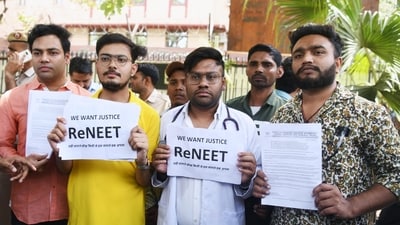 Students holding placards protest against the alleged irregularities in the NEET examination, at Shashtri Bhawan in New Delhi (File) (ANI)