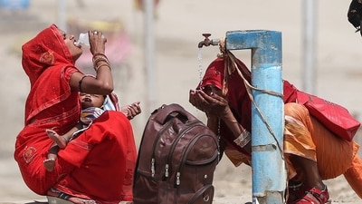 Women quench their thirst with the tap water on a hot summer afternoon during heatwave in Prayagraj. (File) (AFP) Women quench their thirst with the tap water on a hot summer afternoon during heatwave in Prayagraj. (File) (AFP)